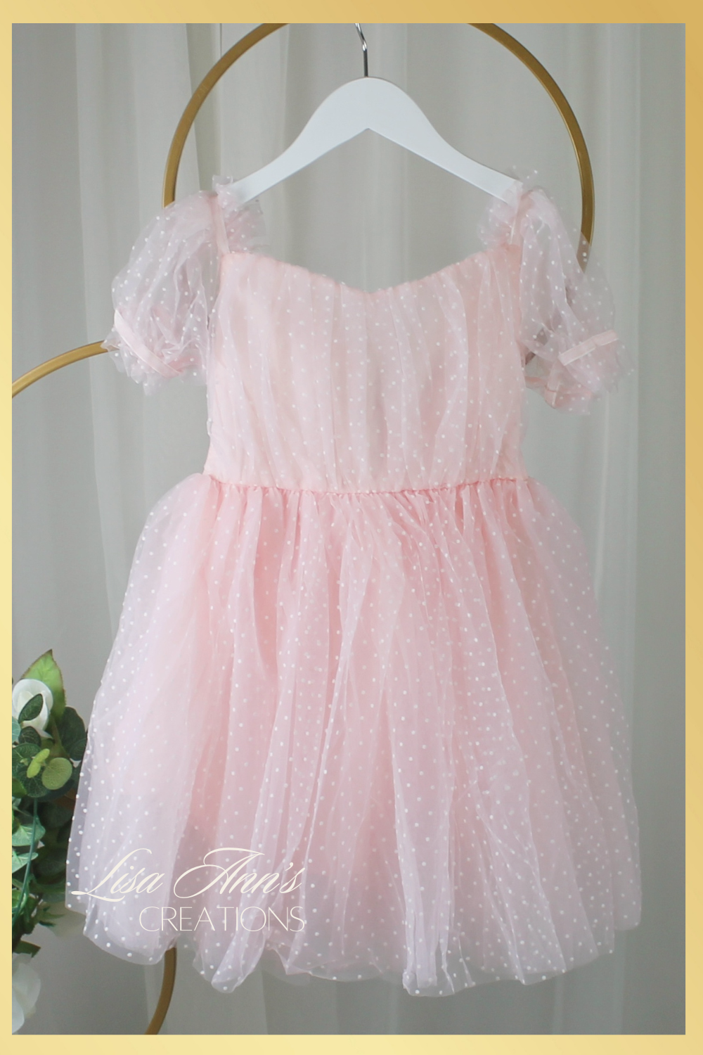 Beautiful light pin siss dot dress for a wedding birthday or any special occasion.