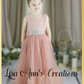 Flower girl dress in a mermaid style in blush tulle and lace