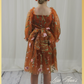 Back picture of Fall Floral girl dress in burnt orange floral embroidery with long tulle sleeves and knee length style. 