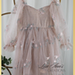 Champagne flower girl dress with long sleeve tulle sleeves. made with a tulip embroidery flower and swiss dot pattern. 