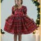 Girls red and green plaid Christmas dress in a short sleeve sweetheart neckline and knee length style. For holiday parties and family photos. 
