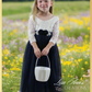 flower girl dress in a ling navy blue tulle with white lace long sleeve bodice. 