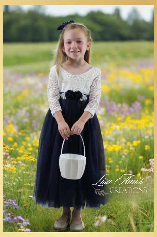 flower girl dress in a ling navy blue tulle with white lace long sleeve bodice. 